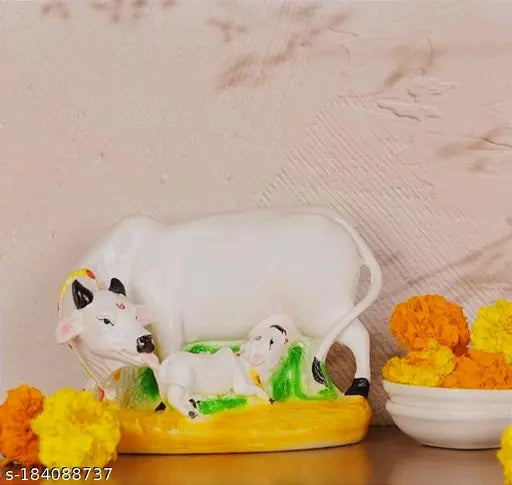 Colorful Resin Kamdhenu Cow Statue with Calf, symbolizing prosperity & love. 3"L x 3"H x 4.5"W, handcrafted in India