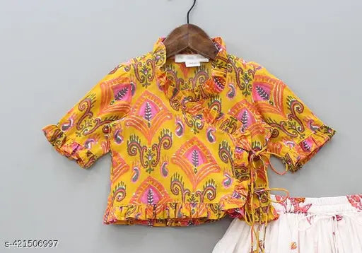 Rayon print traditional Lehenga Choli set for kids, featuring floral designs and short sleeves. Indian-made, western-style crop top and lehenga skirt for party wear