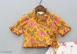 Rayon print traditional Lehenga Choli set for kids, featuring floral designs and short sleeves. Indian-made, western-style crop top and lehenga skirt for party wear