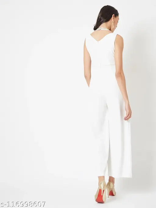 White polyester Miss Chase jumpsuit, off-white solid knit with pleated panel and halter neck, sequin yoke, sleeveless style, available in multiple sizes (XS - XL)