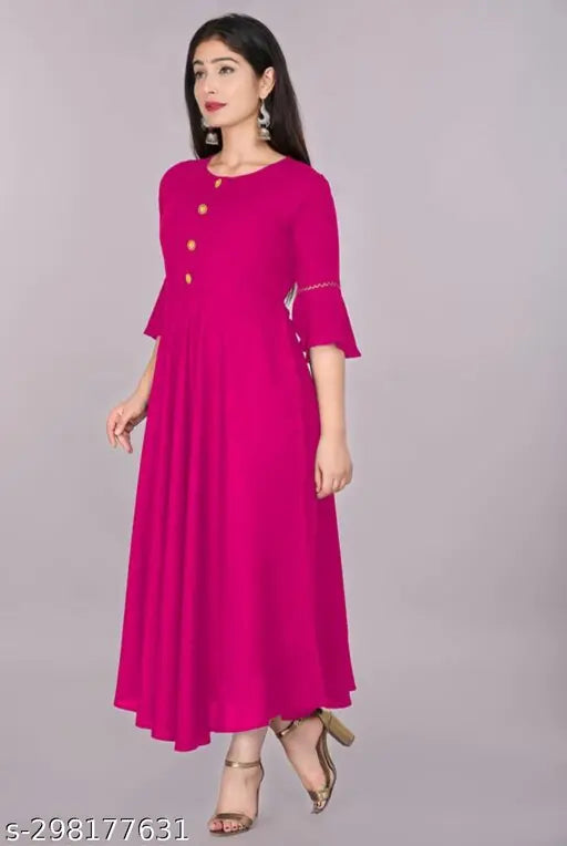 Women's & Girls Fancy Rayon Anarkali Pink Kurti: Solid-colored Indian attire with round neck and three-quarter bell sleeves, made from breathable rayon fabric. Handcrafted in India