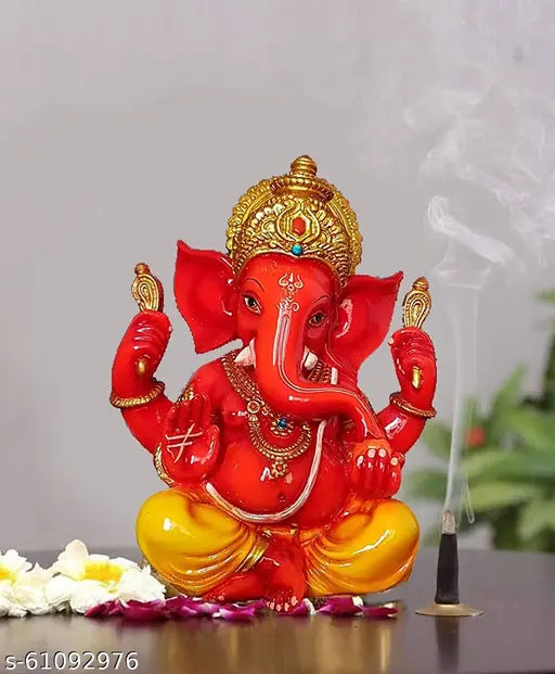 Orange polyresin Ganesh Idol, hand-carved meditating figure, 5.5 x 3.5 inch