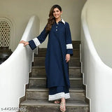 Navy blue rayon Pakistani-style kurta with palazzos, intricate lacework on collar, sleeves, and pant ends