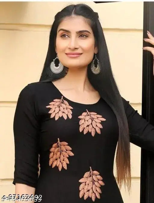 Black kurta with peach embroidered net palazzos, rayon fabric three-quarter sleeves Indian fashion clothing on mannequin
