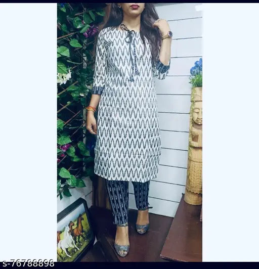 White and Black Stylish Kurta Pant set, printed rayon fabric for casual, comfortable wear by modern women, featuring three-quarter sleeves. Country of Origin: India