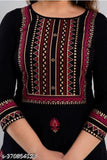 Black embroidered sharara with long sleeves, knee-length skirt, and matching blouse