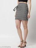 Printed net pencil black skirt, women's polyester mini skirt from Popwings with knot on right side. Alluring all-black and offwhite design for date night, fitted size M (waist 26in, length 19in, hip 32in). Indian origin