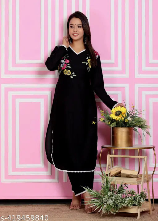 Black rayon embroidered Pakistani kurta set with palazzos, featuring floral prints