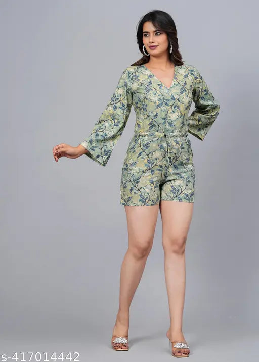 Green rayon short jumpsuit with three-quarter sleeves and printed net pattern. Quality fabric, size M (bust 38in, length 36in, waist 28in). Made in India
