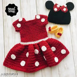 Red wool baby dress with self-design net pattern, short sleeves, suitable for sizes from 0-3 months to 18-24 months. Made in India