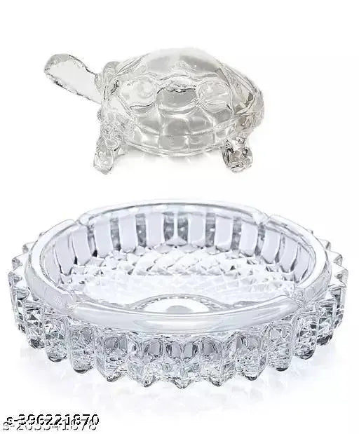 Glass DVM Crystal Tortoise KACHHUA with plate, symbolizing protection, longevity, and good luck. Ideal for Vastu home decor and gifting purposes, measures 12 cm x 3 cm x 12 cm. Traditional Indian showpiece for living rooms, bedrooms, or pooja rooms