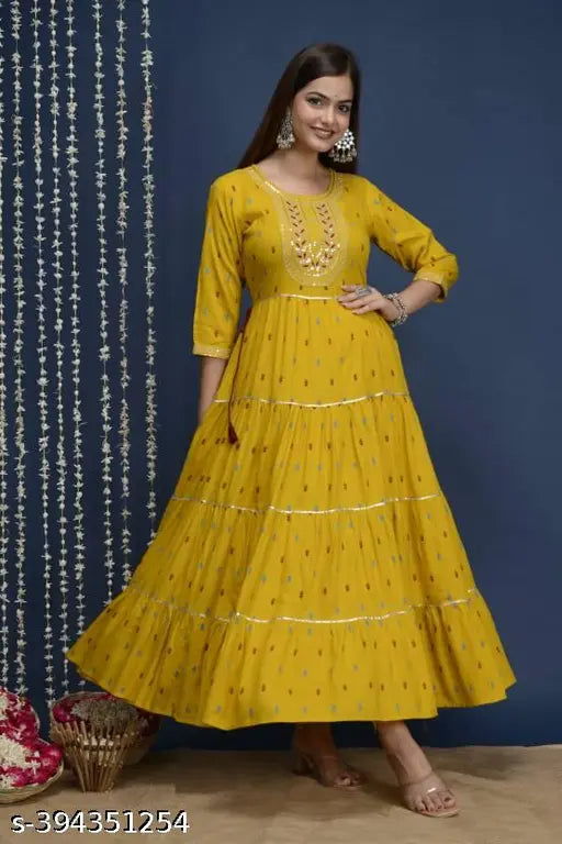 Super yellow rayon kurta with four-tier embroidery, printed pattern on three-quarter sleeves for women's fashion