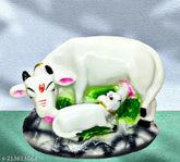 Poly resin Kamdhenu cow statue for home office, 8.5cmL x 12.5cmH x 7cmB, symbolizes prosperity & peace