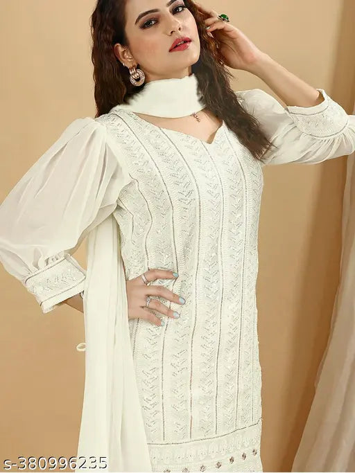 Georgette women's side tie-up kurta sharara set with puffed sleeves and sequin embellishments, paired with flared pants and dupatta. Available in S, M, L, XL sizes