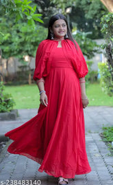 Red Georgette ethnic wear dress for Chhath Puja celebration, grandure Durga Puja outfit. Three-quarter sleeves, fancy padded sleeves, micro cotton inner. Video search: Khushi Ghinaiya on YouTube and Instagram @khushifashion1840." (124 characters)