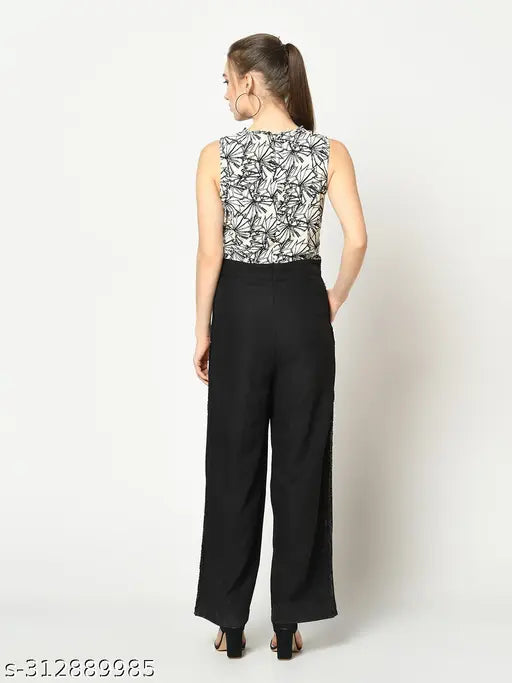 Black & white printed polyester basic jumpsuit with sleeveless design, round neck, and pocket details - women's fashion from India
