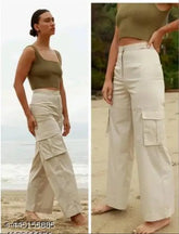 Cream cotton blend cargo pants, high rise with slanted inset pocket & patch. Women's sizes: S, M, L, XL (28in, 36in, 36in, 34in). Also available in 30in, straight fit, stretchable, and suitable for casual and formal wear. Made in India