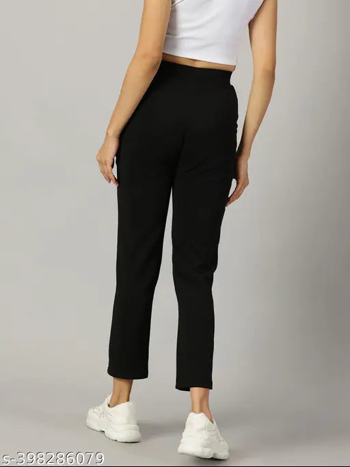 Black polyester skinny fit trouser, elastic band closure, ankle length
