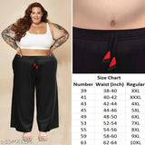 Chic black plus-size palazzo trousers with big pockets, perfect for loungewear and sleepwear