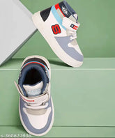 Stylish grey synthetic leather Jordans for kids, colorblocked pattern with PVC sole. Ideal for boys' playtime