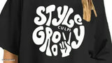 Black cotton blend oversized tee with 'Stay Groovy' moon child print, three-quarter sleeves