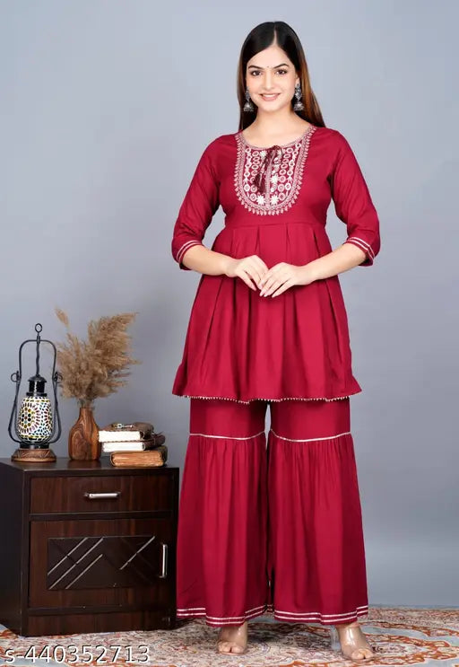 Rayon printed kurta sharara set with dupatta, sequinned embroidery on a vibrant Indian design. Premium rayon fabric for comfort and style on diverse occasions. Available in sizes M-XXL. Made in India