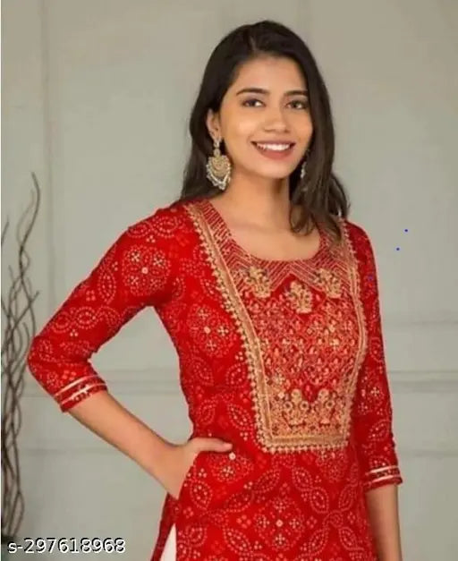 Red and gold embroidered kurta set with flared sleeves