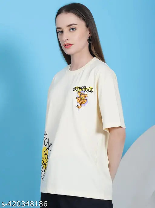 Women's cotton printed oversize t-shirt, short sleeves, vibrant print, available in sizes S-XXL. Bright fashion tee on display. Made in India