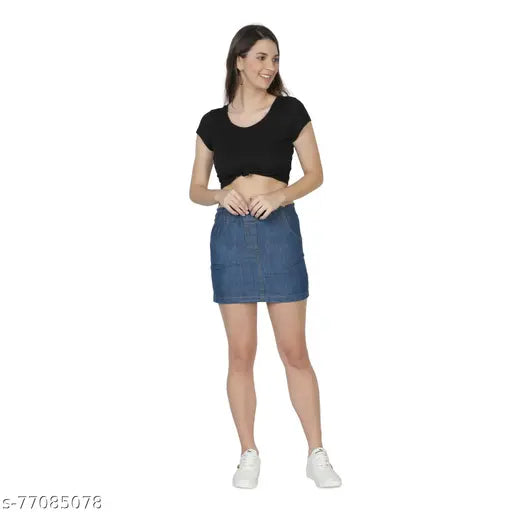 Medium blue denim mini skirt, solid patterned denim with paneling, slit back and pockets. Well-crafted denim skirt perfect for casual outfits, available in sizes 28, 30