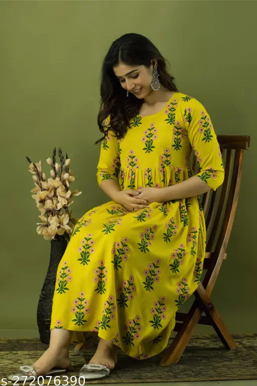 Rayon printed maternity gown with feeding zip, three-quarter sleeves. M - Bust 38in, Length 44in; L - Bust 40in, Length 44in; XL - Bust 42in, Length 44in; XXL - Bust 10in, Length 44in. India-made maternity wear