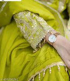 Green silk kurta with embroidery and sequins, three-quarter sleeves, Chinon fabric. Matching plazzo and dupatta also in heavy Chinon silk with embroidery and sequins