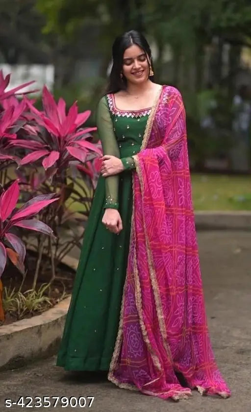 Green Georgette Maxi Gown with mirror work and stonework, paired with pink printed dupatta. Indian-made casual evening wear