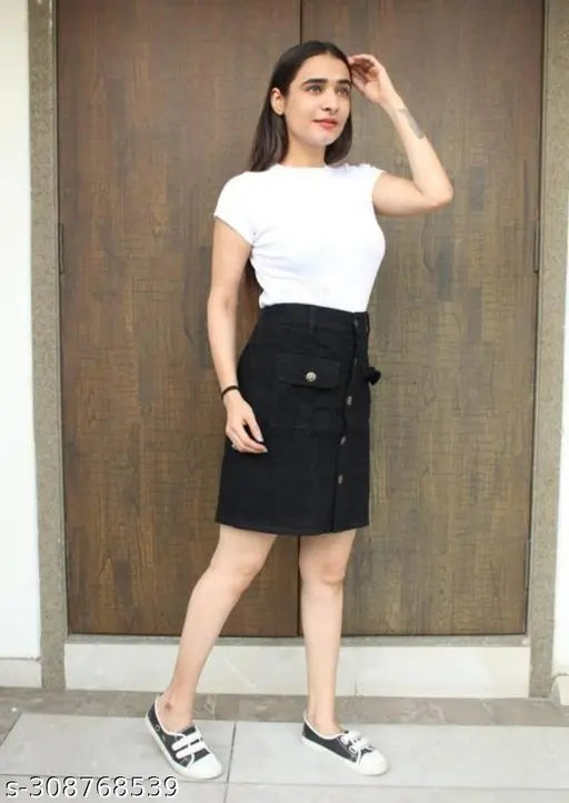 Trendy women's and girls black denim mini skirt, cotton short skirt for summer in three sizes (26, 28, 30). Solid black denim skirt on display