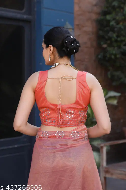 Orange net saree with embroidered blouse, best quality Indian traditional wear on mannequin