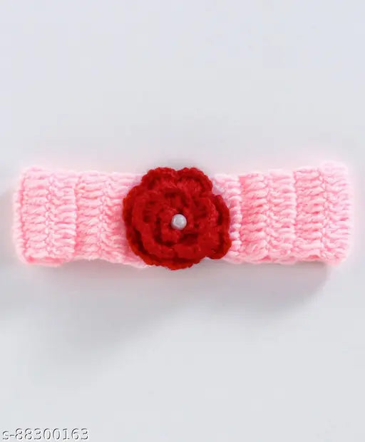 Handmade pink acrylic crochet baby frock with one flower pattern, suitable for infants aged 0-3 months to 3-4 years. Made in India