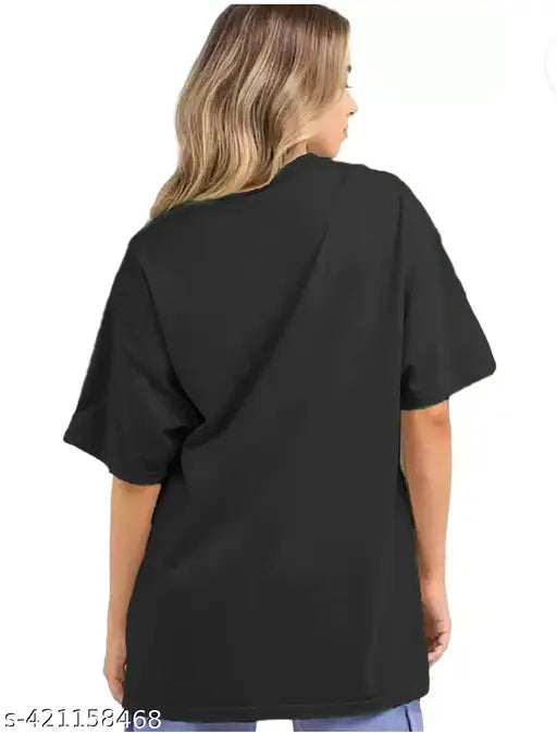 Oversized black cotton blend t-shirt with 'Stay Groovy' print, three-quarter sleeves, suitable for casual wear