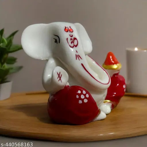 Red compact Ganesha statue, ideal for car dashboards, desks, or offices, symbolizing Lord Ganesh and Diwali decoration from India