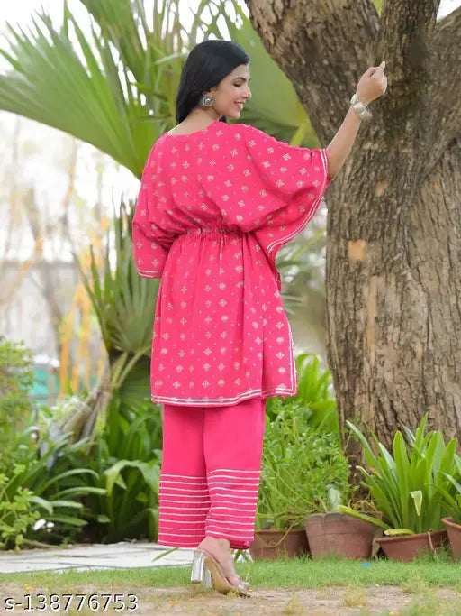 Rayon printed net kurti and palazzo set, trendy short sleeves, attractive for work or festivities. Indian-origin fashion