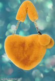 Plush PU heart-shaped crossbody bag for women, solid pink color with pom poms, perfect gift idea