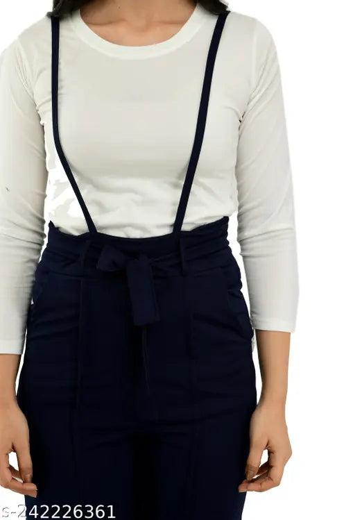Navy blue cotton blend dungaree set with matching white t-shirt, solid pattern for women's casual wear on display stand