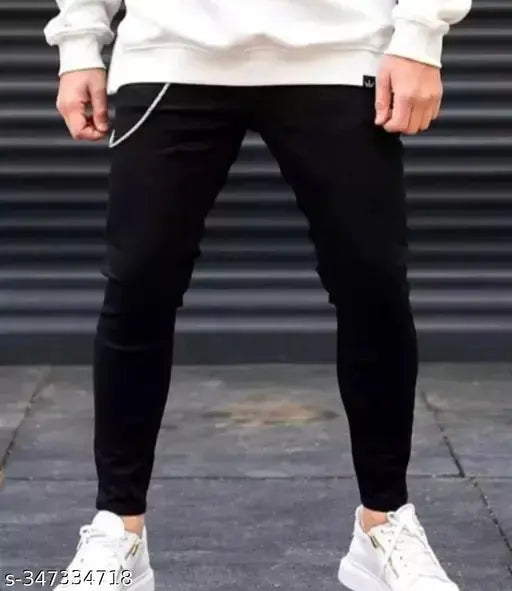 Plain black cotton blend jeans for men, SDK2OFK style on display rack