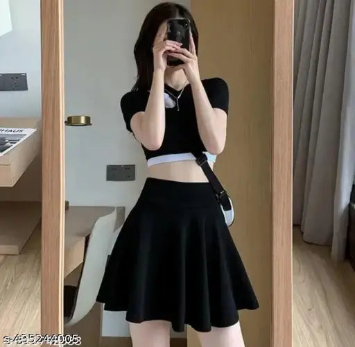 Black polyester solid skater mini skirt, high waist and flared hem for women's basic casual wear, stretchy design with elastic waistband