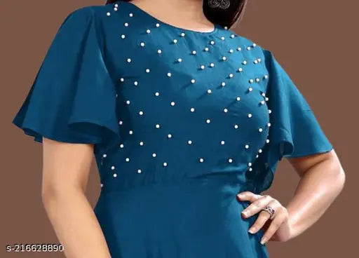 Embellished rayon short sleeve gown for girls aged 7-15 years, Indian handcrafted net pattern on display