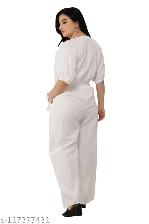 White cotton linen jumpsuit with short raglan sleeves, solid pattern, v-neckline, elastic & smocking detailing, two pockets, zipper closure, and attached belt - India origin