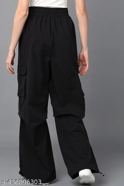 Black jumpsuit with tie waist, cropped flared legs and side pockets