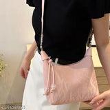 Synthetic GuKa dumpling sling bag for women and girls, free size, solid net color, hand carry style