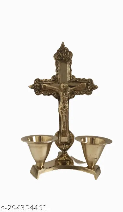 Antique finish brass Christian cross statue with attached candle stand, featuring idol of Jesus Christ. Perfect for prayer and worship decor in home or office. Measures approximately 5 inches tall (13 cm)