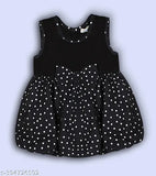 Black polka dotted cotton blend balloon dress for children, featuring charming bow detail and midi length with round neck design, ideal for various occasions. Made in India