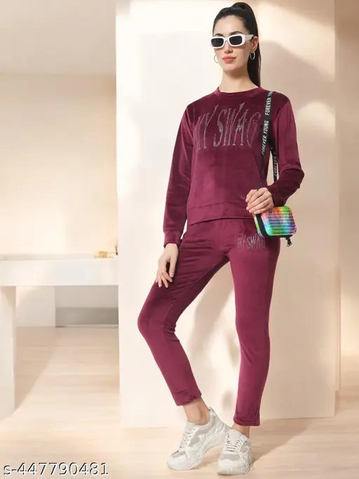 Women's winter wine color velvet track suit set with sweashirt and pyjama, featuring long sleeves and soft, comfortable fabrics. Ideal for a stylish and sensual look in the bedroom. Perfect gift for loved ones, originating from India