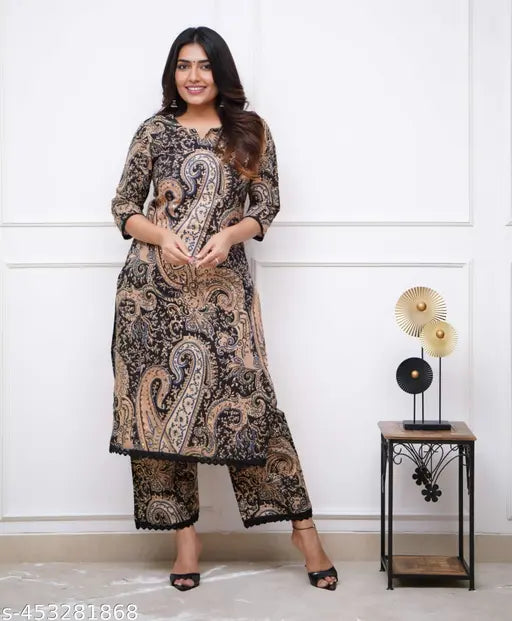 Black Cary print lacework kurti set with palazzos, made from cotton cambric. Indian ethnic outfit with intricate prints and delicate lace detailing for casual or semi-formal occasions
